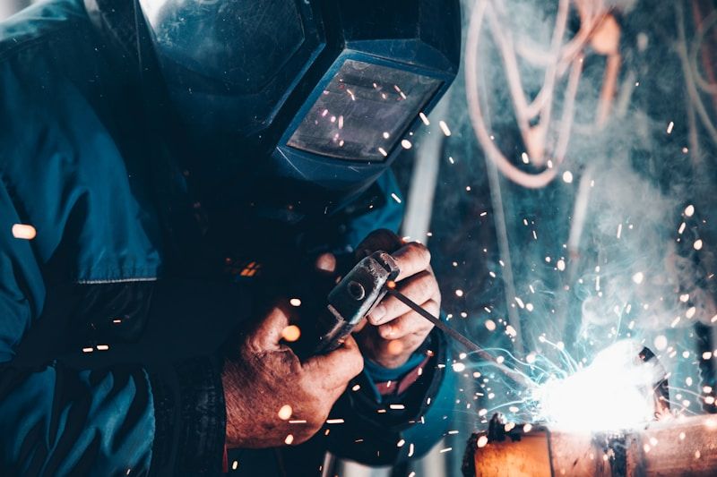 Welder wearing personal protective equipment